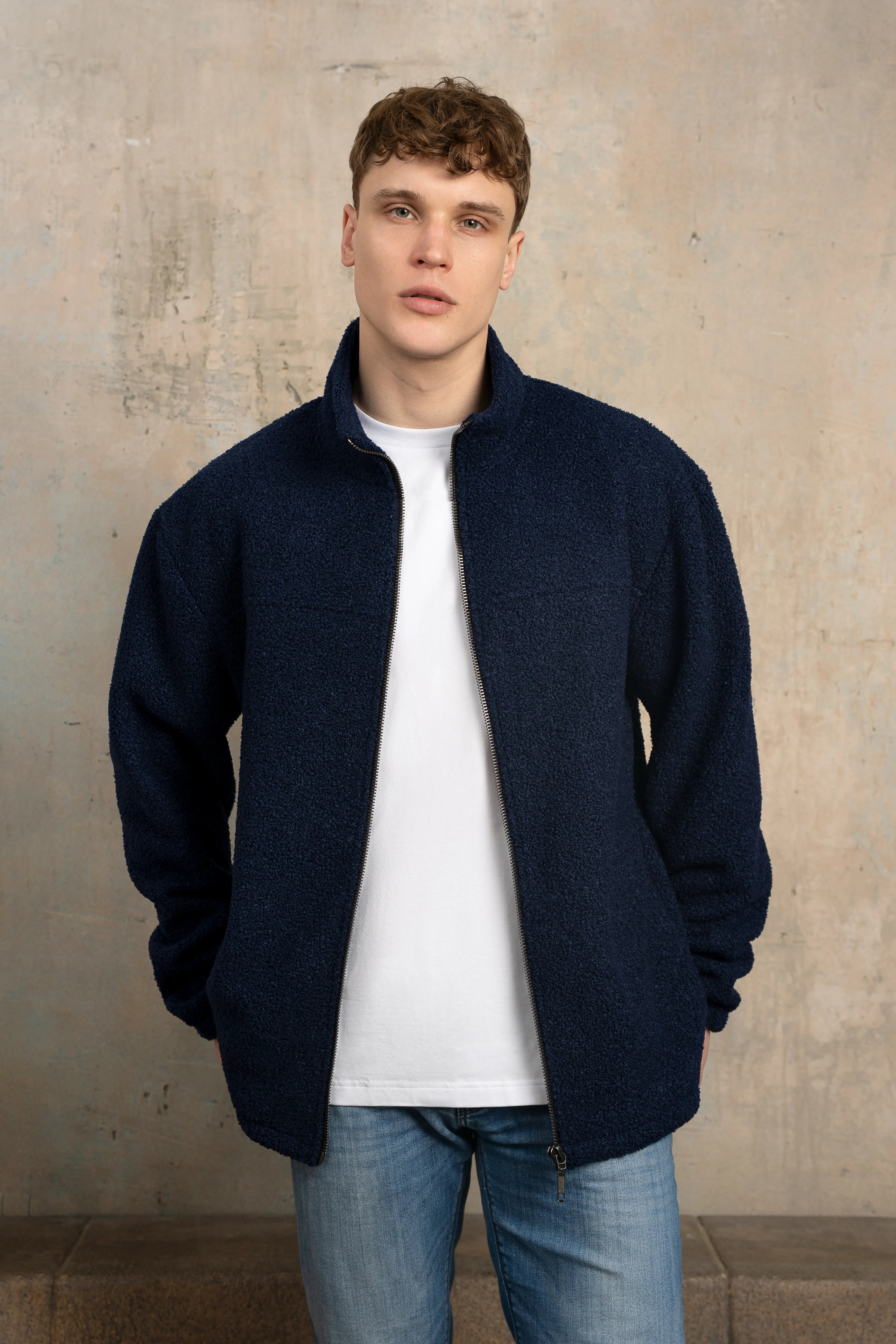 Dark navy men’s zip-up sweatshirt with a full-length zipper, stand-up collar, long sleeves, and a relaxed fit