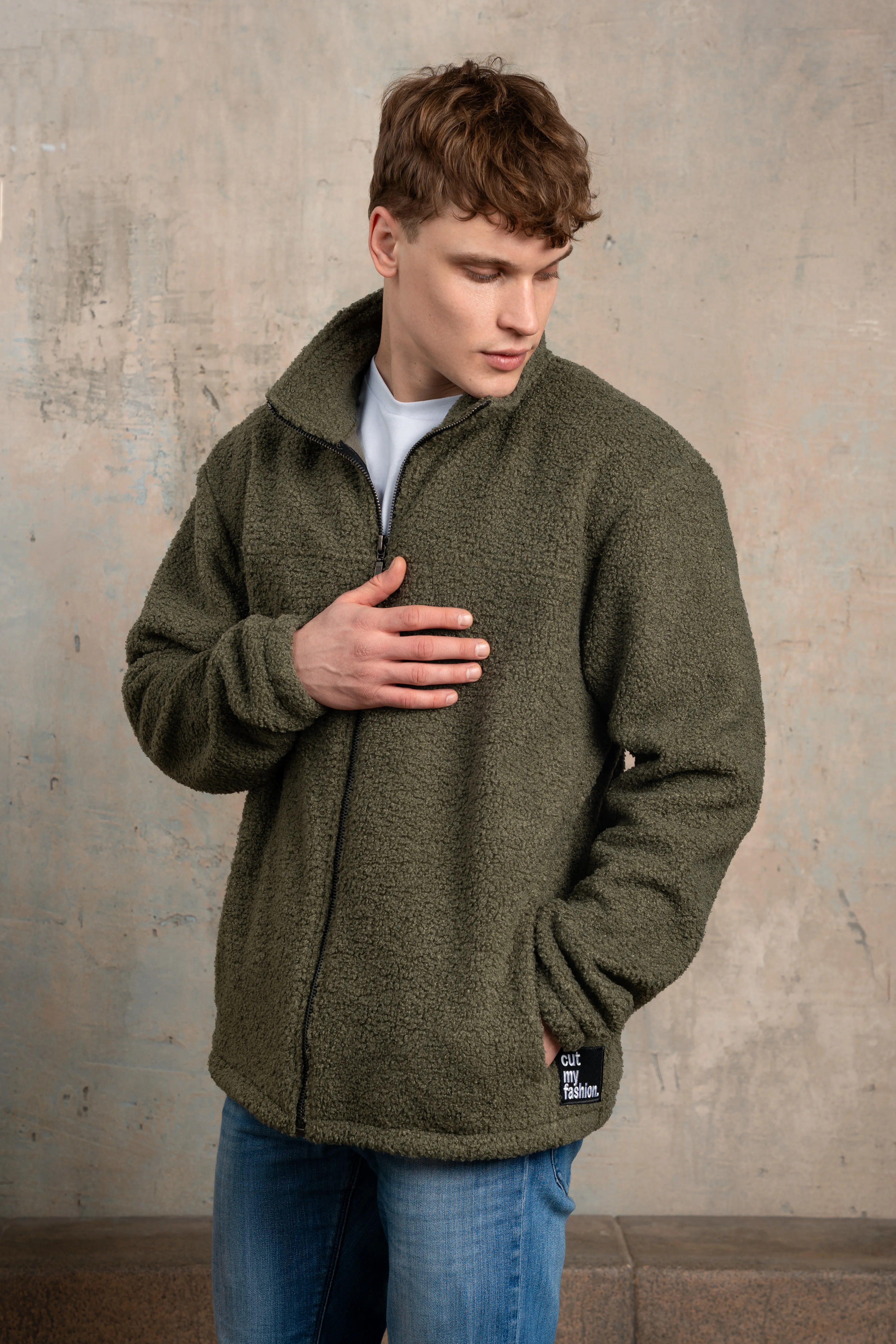 Khaki men's zip-up sweatshirt with a full-length zipper, stand collar, pockets, and side view