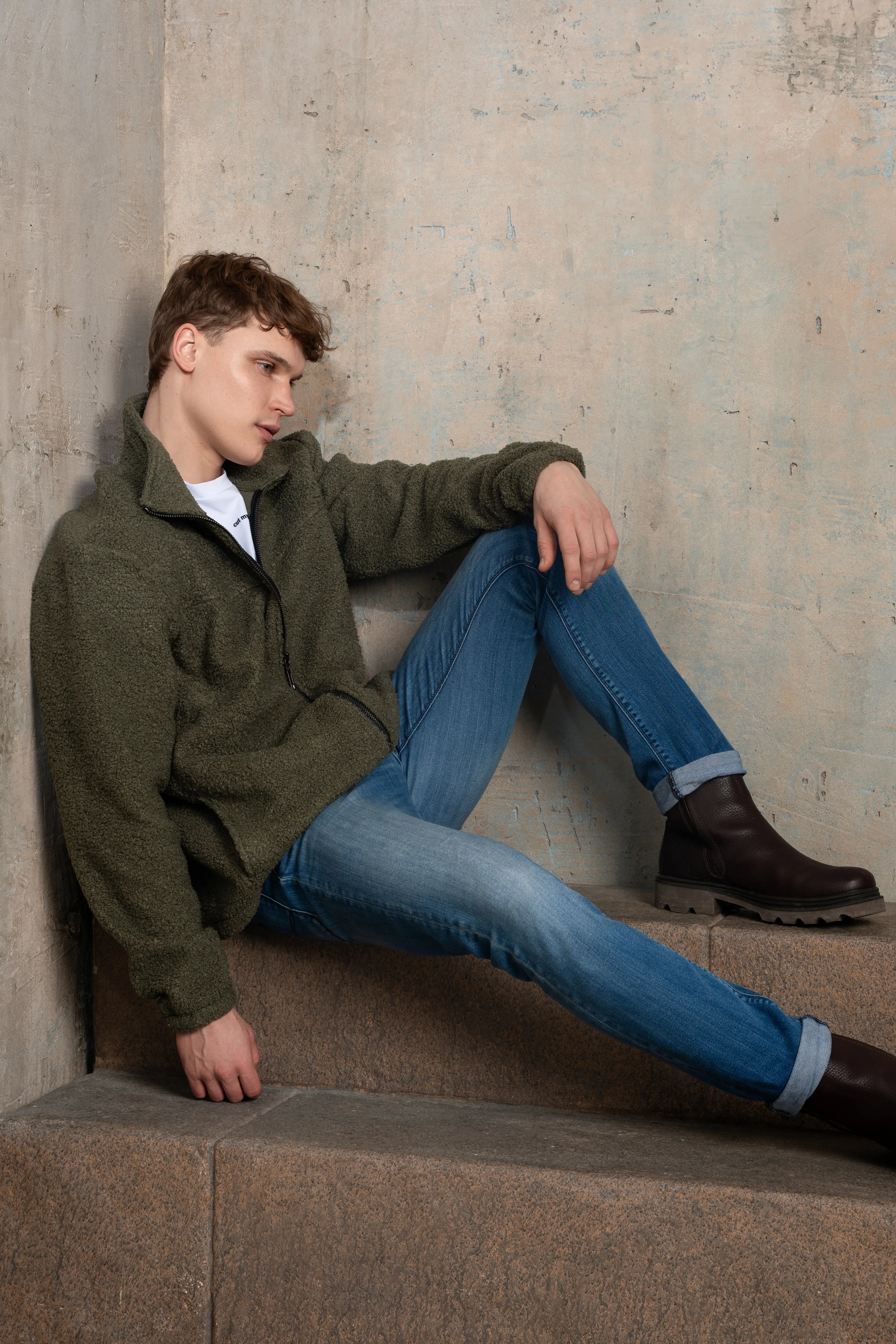 Khaki men's zip-up sweatshirt with a full-length zipper, stand collar, long sleeves, and side view