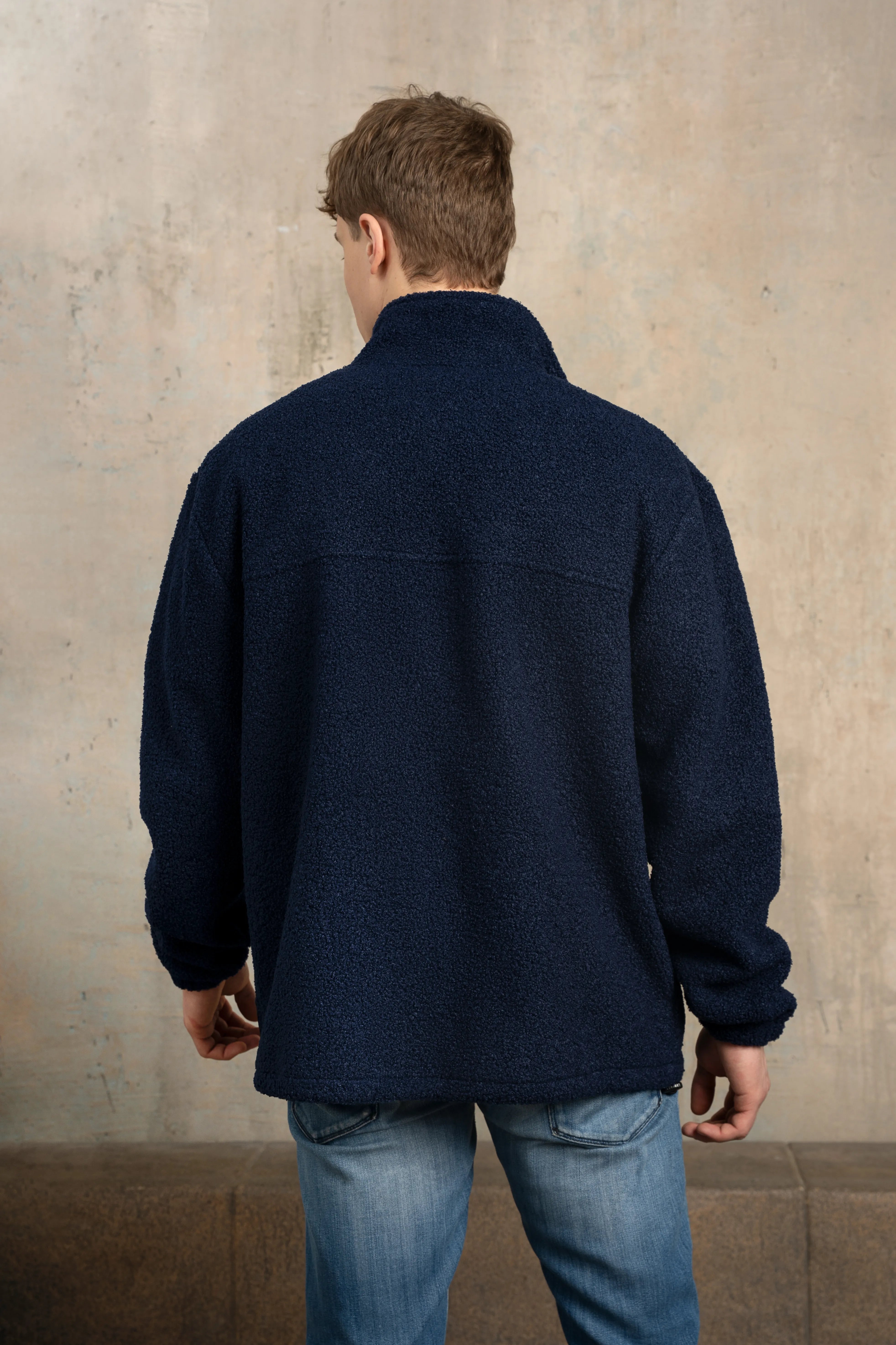 Dark navy men’s zip-up sweatshirt, back view, with a stand-up collar, long sleeves, and a straight back line