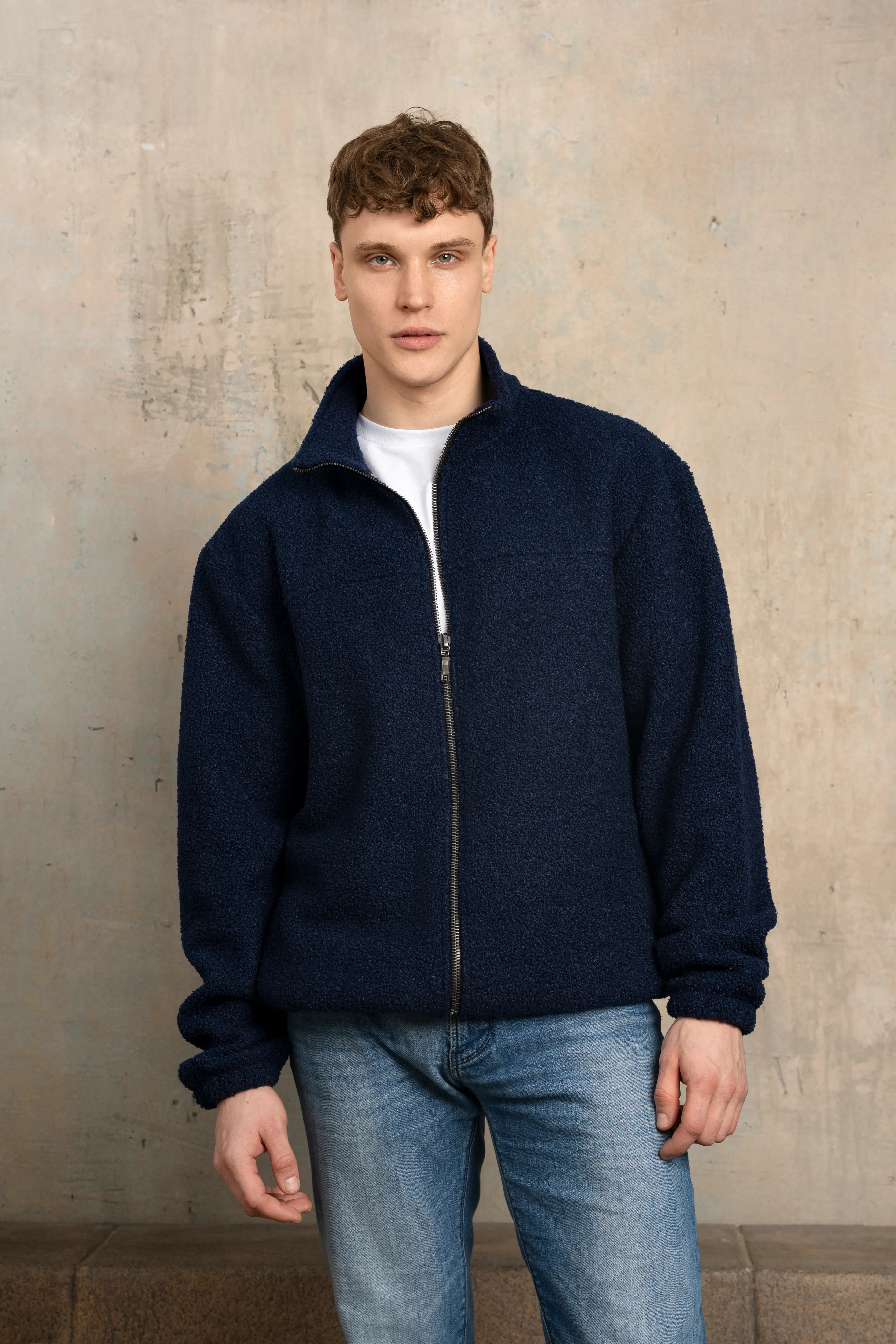 Dark navy men’s zip-up sweatshirt with a full-length zipper, stand-up collar, long sleeves, front view