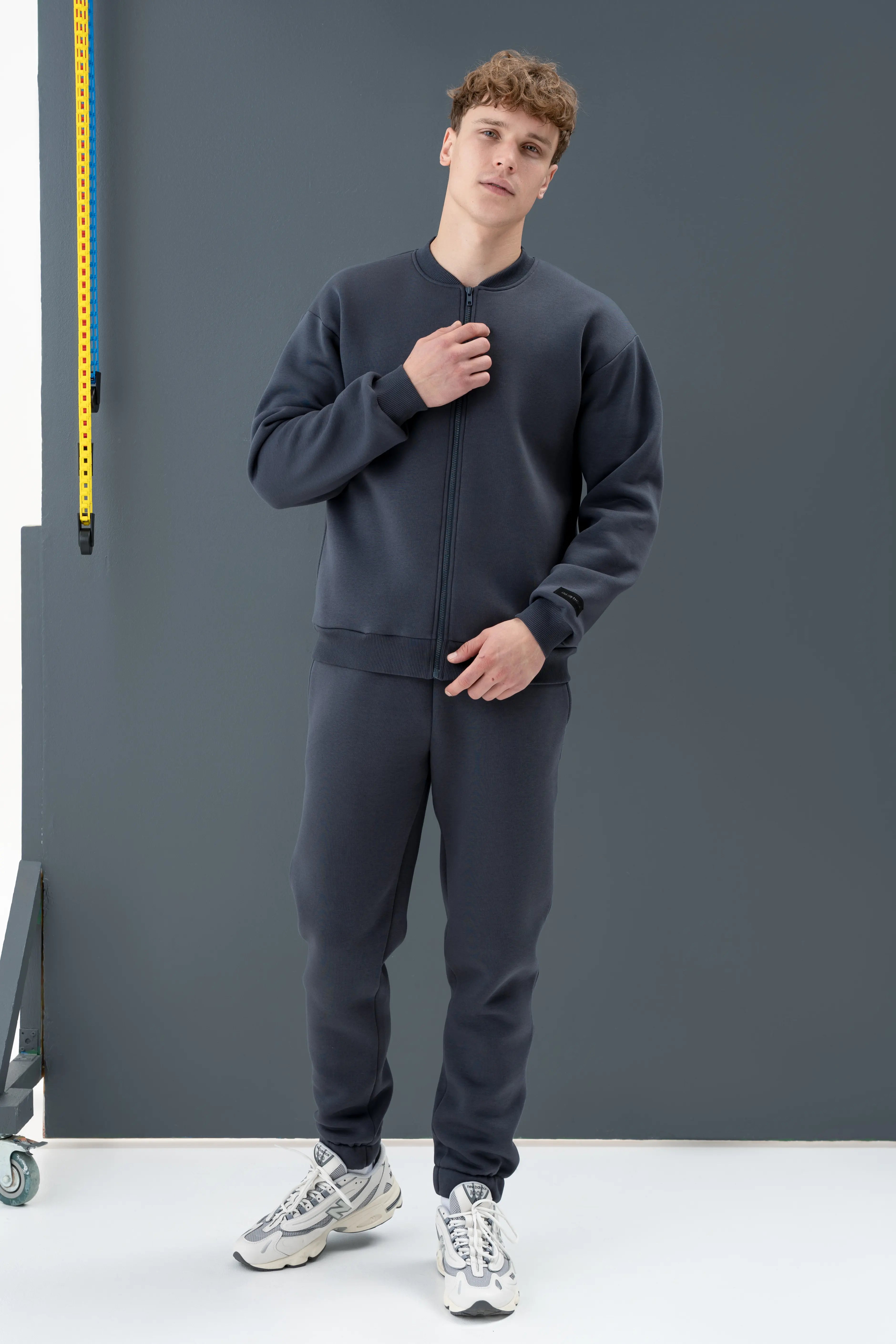 A stylish dark grey casual tracksuit for men, sewn in the cutmyfashion sewing workshop in Lithuania.