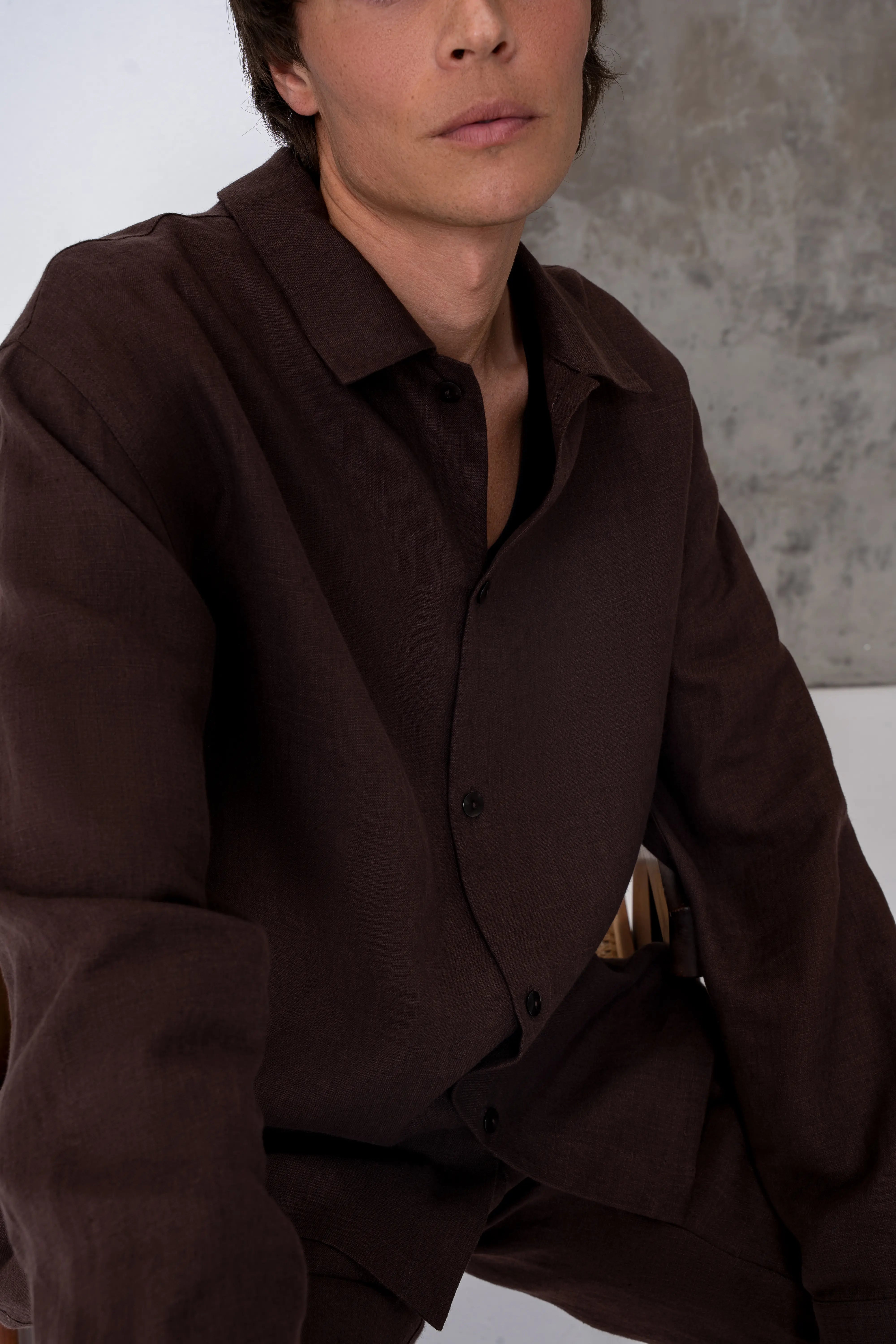 Brown men’s linen shirt with a classic collar, close-up view