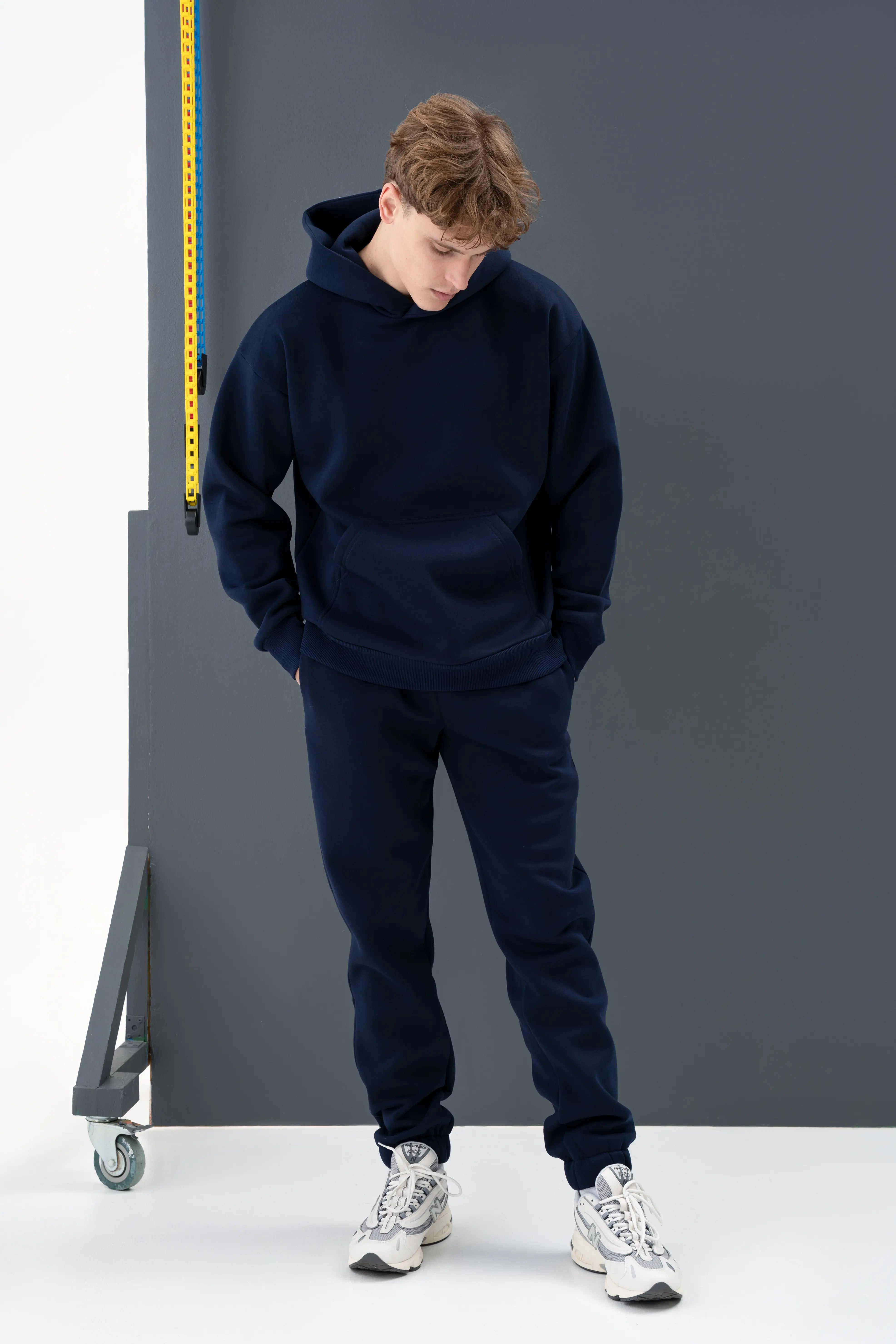 A stylish blue casual tracksuit with a sweatshirt and pants, designed in Lithuania.