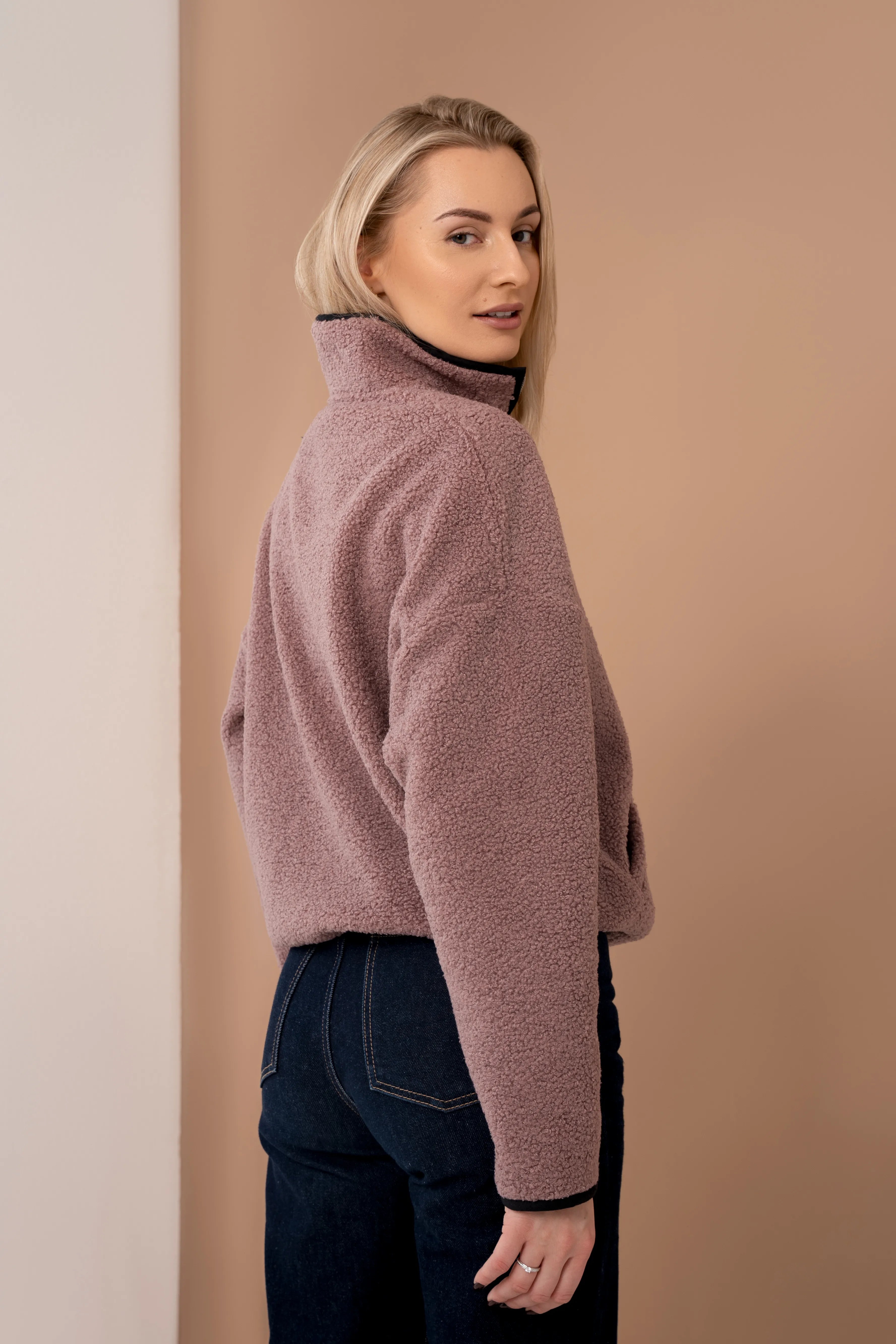 Pink women’s sweatshirt from the back with a stand-up collar, sweatshirt with a zipper